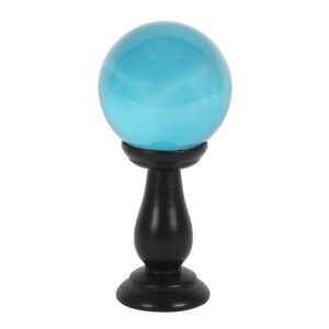 pequeña bola de cristal verde azulado sobre soporte