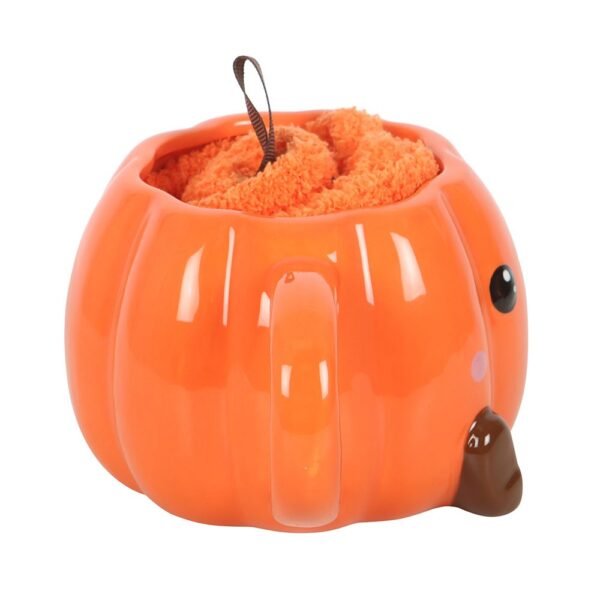 juego de taza y calcetines con forma de calabaza sonriente