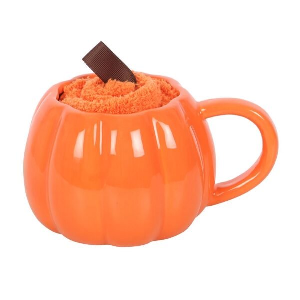 juego de taza y calcetines con forma de calabaza sonriente