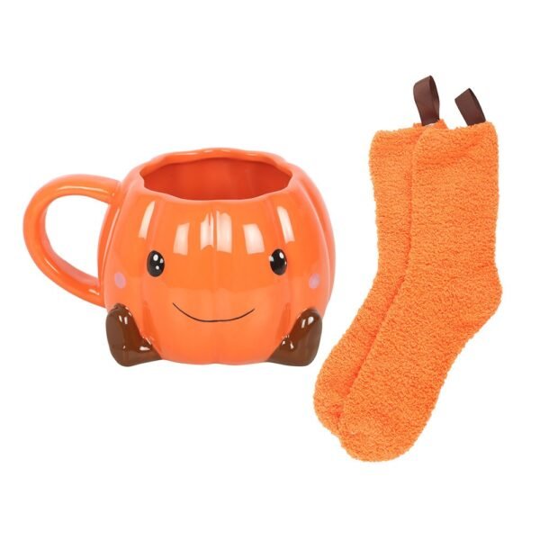 juego de taza y calcetines con forma de calabaza sonriente