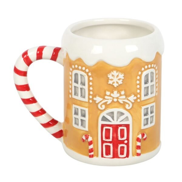 taza de casa de jengibre con bastón de caramelo