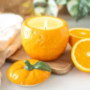 Tarro de vela con forma de naranja