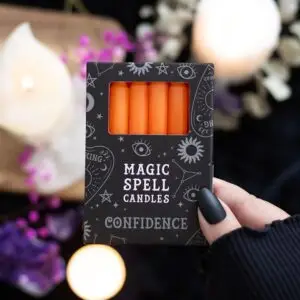 Paquete de 12 velas naranjas con el hechizo "Confianza"
