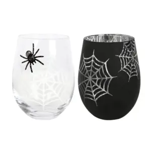 Copas sin pie con araña y telaraña con las copas blanca y negra sobre fondo blanco