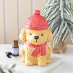 Quemador de aceite Cachorro de invierno en una escena invernal decorativa