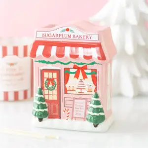 Quemador de aceite Sugarplum Bakery en una escena navideña rosa