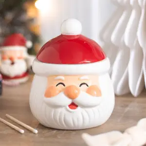 Quemador de aceite y cera Papá Noel cerrado en una escena navideña