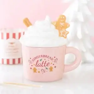 Quemador de cera Pink Gingerbread Latte en una escena navideña rosa