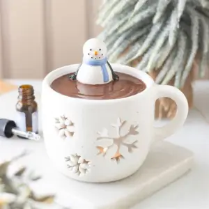 Quemador de cera Snowman Hot Chocolate en una escena invernal decorativa